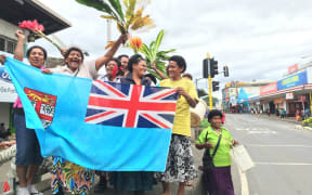 Fijians celebrate the country's first Olympic medal after its sevens team won gold.