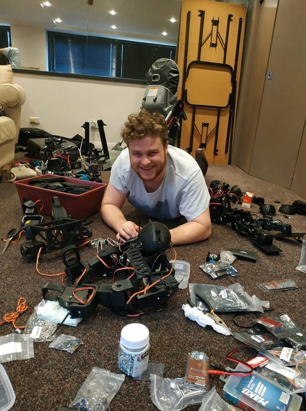 Banon swimming in sea of electronics as the team gets ready for the competition.