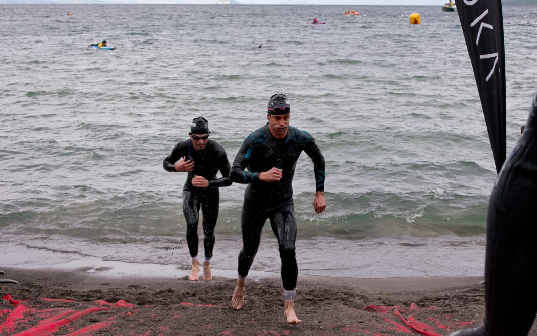 Steve McKenna (right), in first place, at the Taupō Ironman, on 2 March 2024.