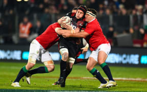 Matt Todd of the Crusaders is tackled by Sean O'Brien and Jamie George.