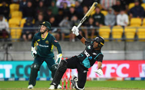 Rachin Ravindra cracks a six in the first Chappell-Hadlee Trophy T20 International against Australia.