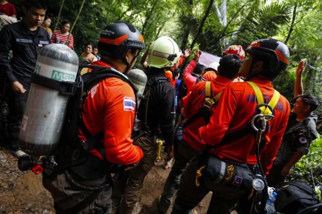 Thai rescue personnel arrive at the Tham Luang cave to conduct operations to find the missing members of the children's football team in a cave chamber along with their coach at the cave in Khun Nam Nang Non Forest Park in Chiang Rai.