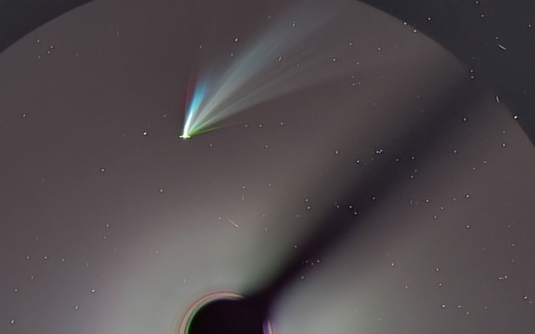 Pictured is a SOHO (LASCO C3) image of Comet ATLAS that is a composite of several different color filters. Of the several tails visible, the central white tails are likely made of dust and just reflecting back sunlight. The red, blue, and green tails are likely ion tails with their colors dominated by light emitted by specific gases that were ejected from the comet and energized by the Sun.