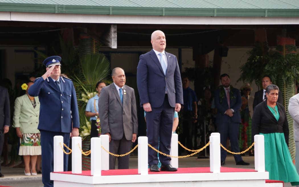 Christopher Luxon stands during a ceremony in Niue.