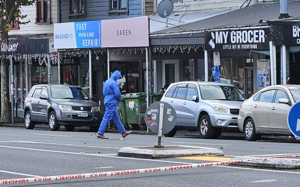 Police examiners at a section of Ponsonby Road, where they have cordoned off the area due to a homicide investigation, on 6 May, 2024.