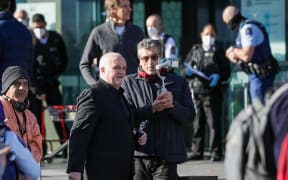 Anti-government protesters have gathered outside the entrance to Christchurch's Court buildings this morning as Counterspin Media hosts were due to appear in court.