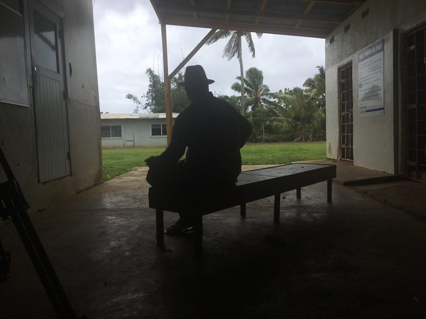 An actor role plays as tyrant, Cecil Hector Larsen - silhouetted from behind