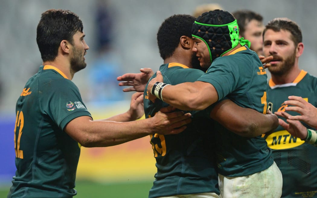 Cheslin Kolbe of South Africa celebrates with try scorer Lukhanyo Am of South Africa.
