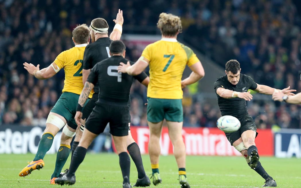 All Black Dan Carter kicks a drop goal in the 2015 Rugby World Cup final.