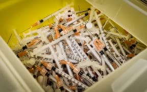 Bin of discarded needles