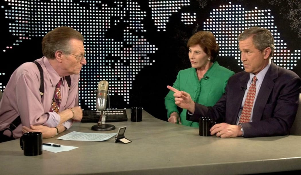 (FILES) In this file photo taken on September 26, 2000, Republican presidential nominee George W. Bush and his wife Laura appear with talk show host Larry King on Larry King Live in Los Angeles.