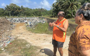 Aitutaki National Environment Service workers Bobby Bishop & Linda Ruamoana discuss plans for the island's recycling centre