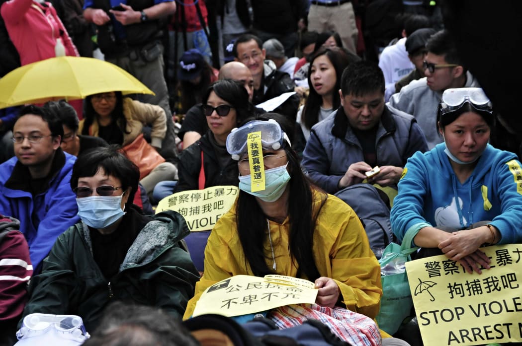 Pro-democracy protesters sit in and refuse to move, central Hong Kong.