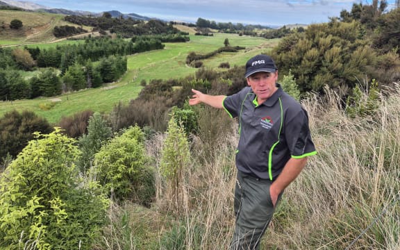 Jason Christensen overlooking recent plantings on the farm.