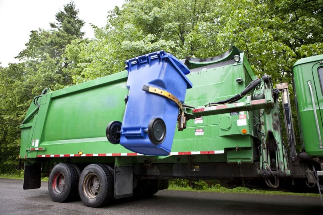 WorkSafe says recycling companies should review how they prevent people from climbing into bins (file picture).