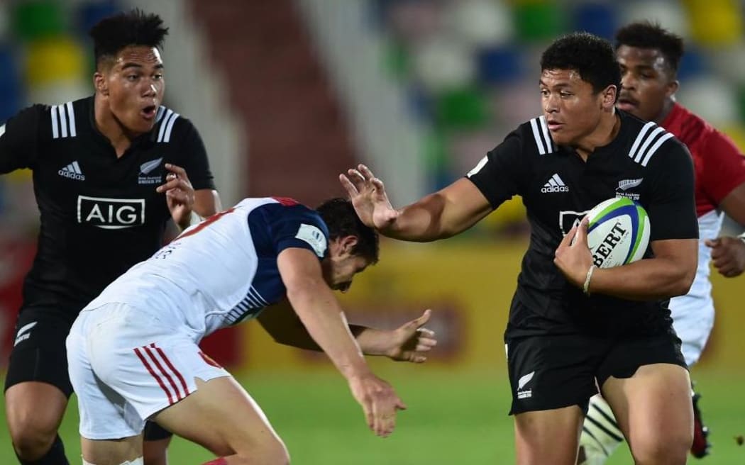 New Zealand winger Caleb Clarke looks to hand off the French defence in their semi-final win at the World Rugby U20 Championship in Tbilisi, Georgia.