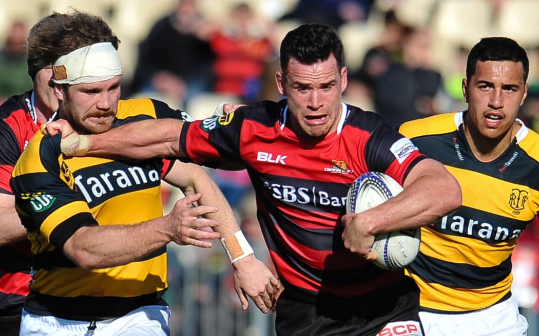Canterbury's Ryan Crotty fends off Berny Hall of Taranaki during the ITM Cup rugby match, Canterbury v Taranaki, at AMI Stadium, Christchurch, on the 27th September 2015. Copyright Photo: John Davidson / www.photosport.nz