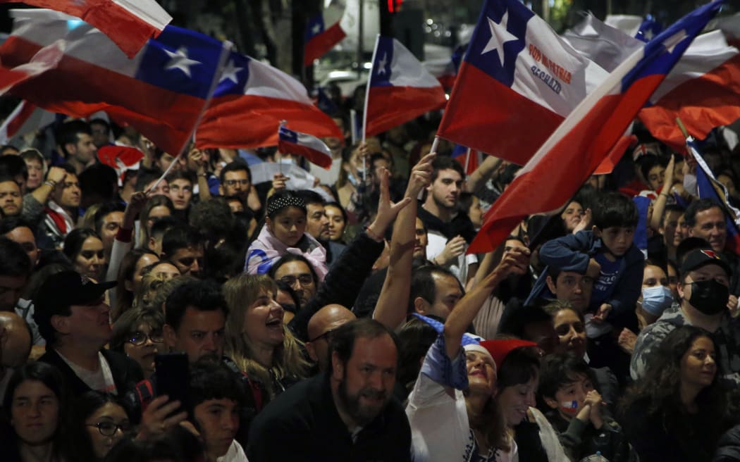 People rejecting the new constitution draft celebrate after knowing the first results of the referendum vote, in Santiago, on 4 September, 2022.