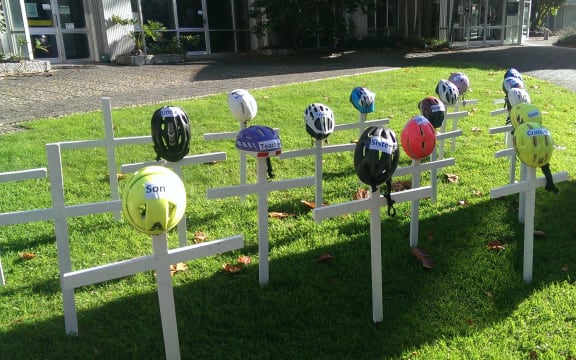 Cyclists have erected a graveyard outside Auckland Council to push for better cycle lanes.