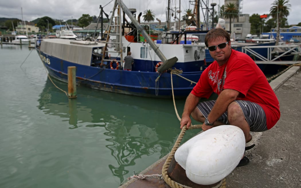 Captain Reuben Dawe tying down his vessel before expected high swell in Gisborne Port.
