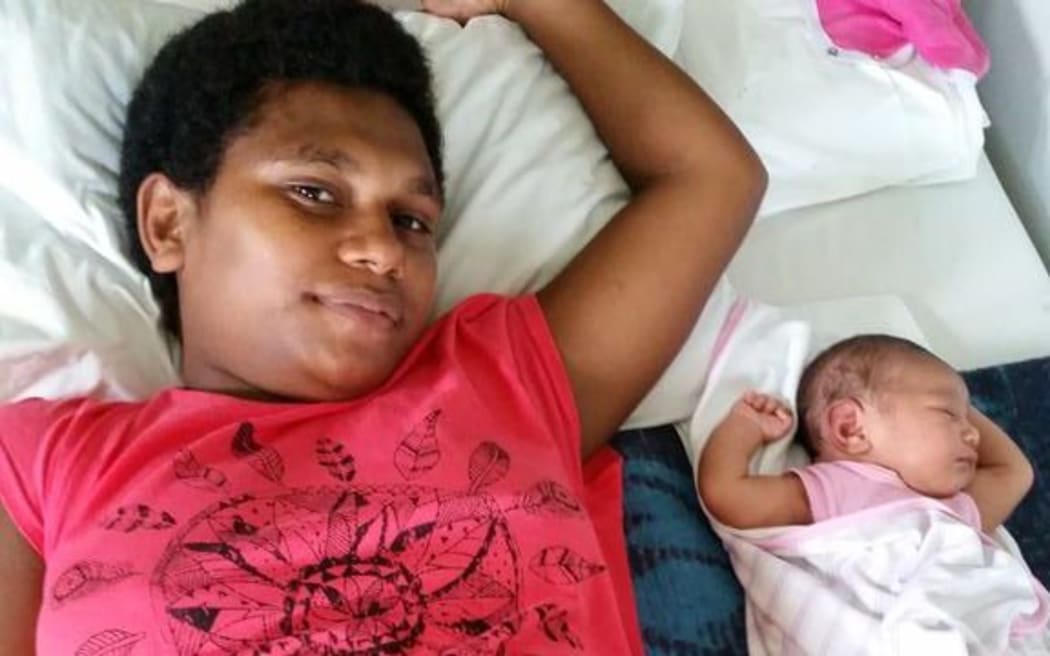 Ana Ravoka with her baby, the first baby delivered in Ra Maternity Hospital since Cyclone Winston