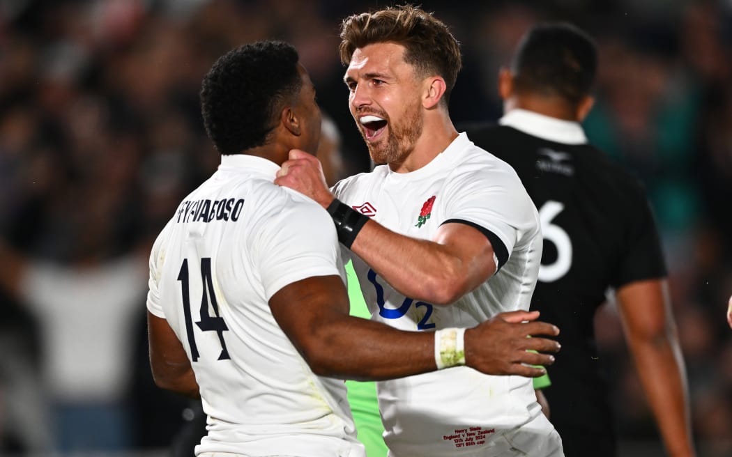 England's Immanuel Feyi-Waboso and Henry Slade celebrate.