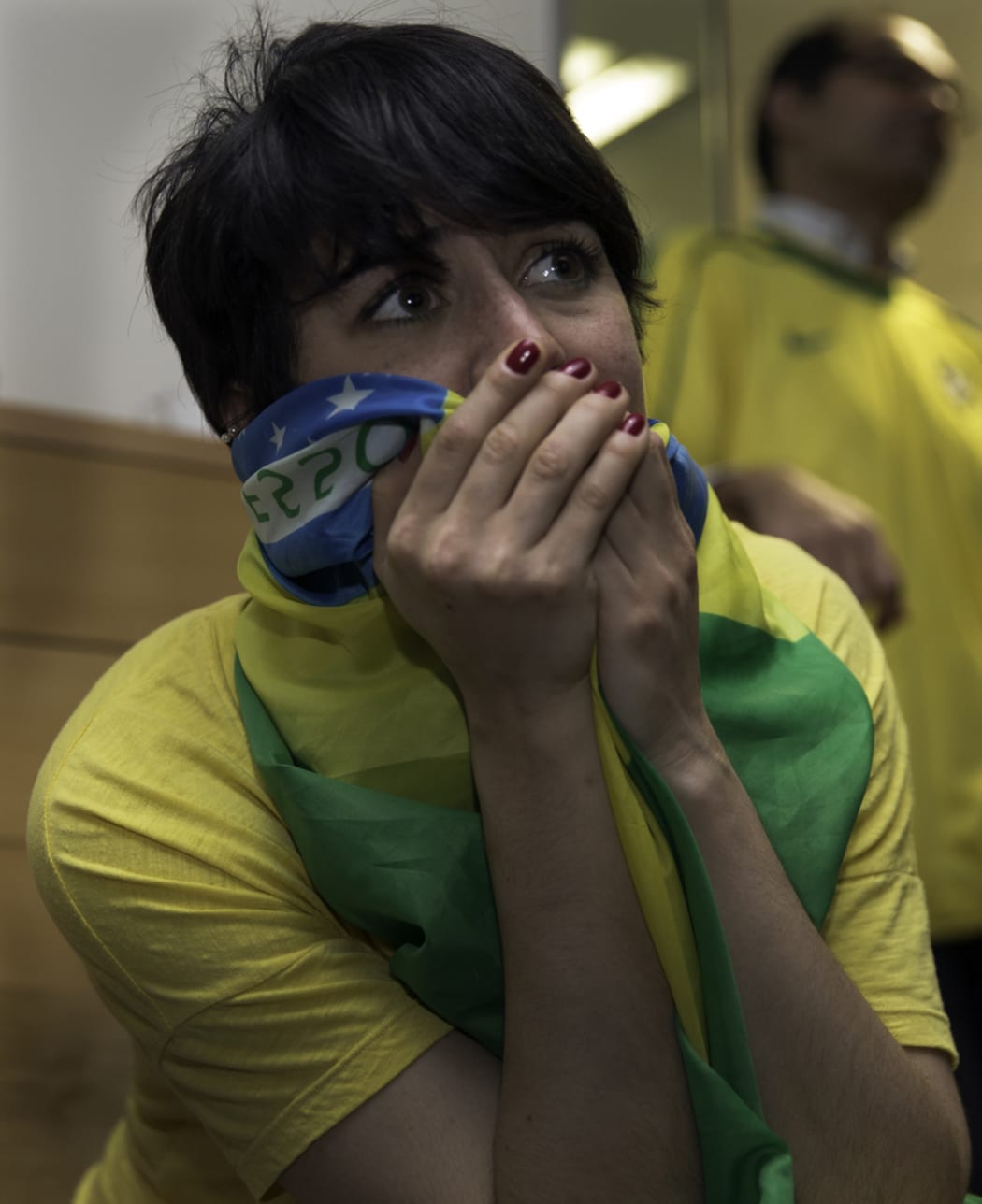 A Brazil fan reacts to the team's 7-1 defeat to Germany in 2014.