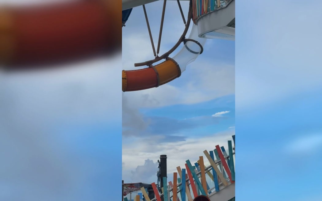 A photo taken by a cruise passengers shows a hole in an acrylic waterslide on Icon of the Seas.