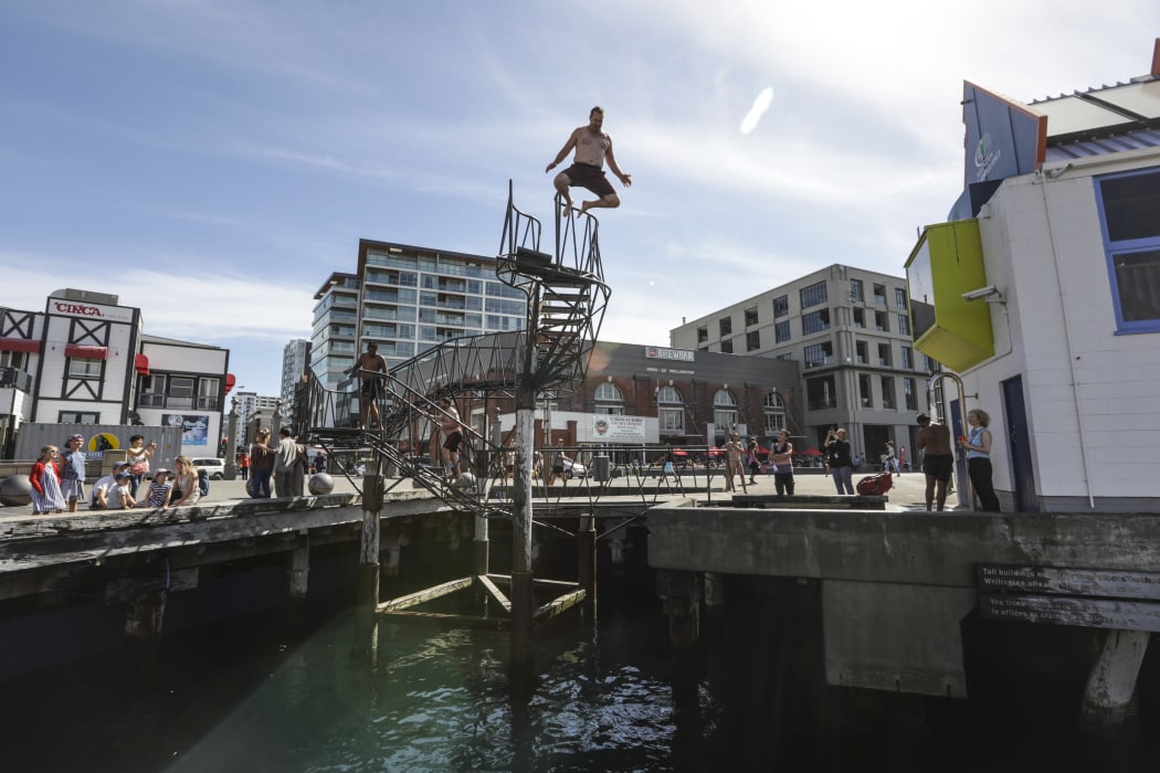 Summer in Wellington, people jump into the harbour.