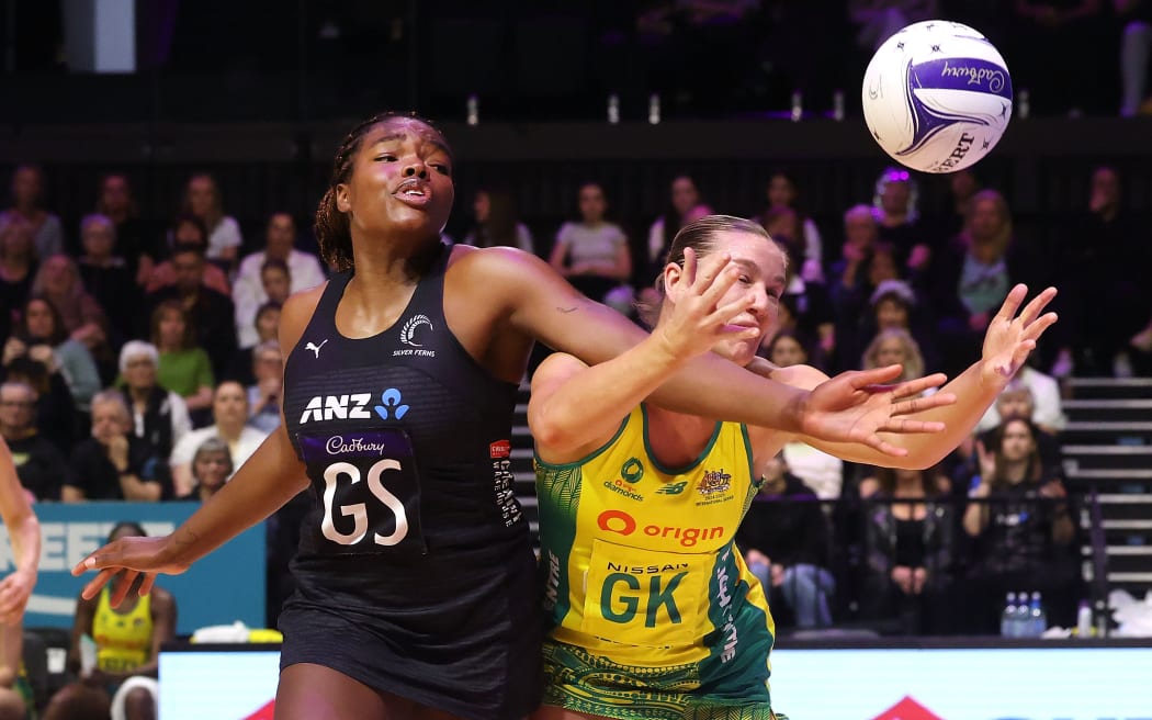Silver Ferns Grace Nweke (L) and Australia's Courtney Bruce contest possession.
