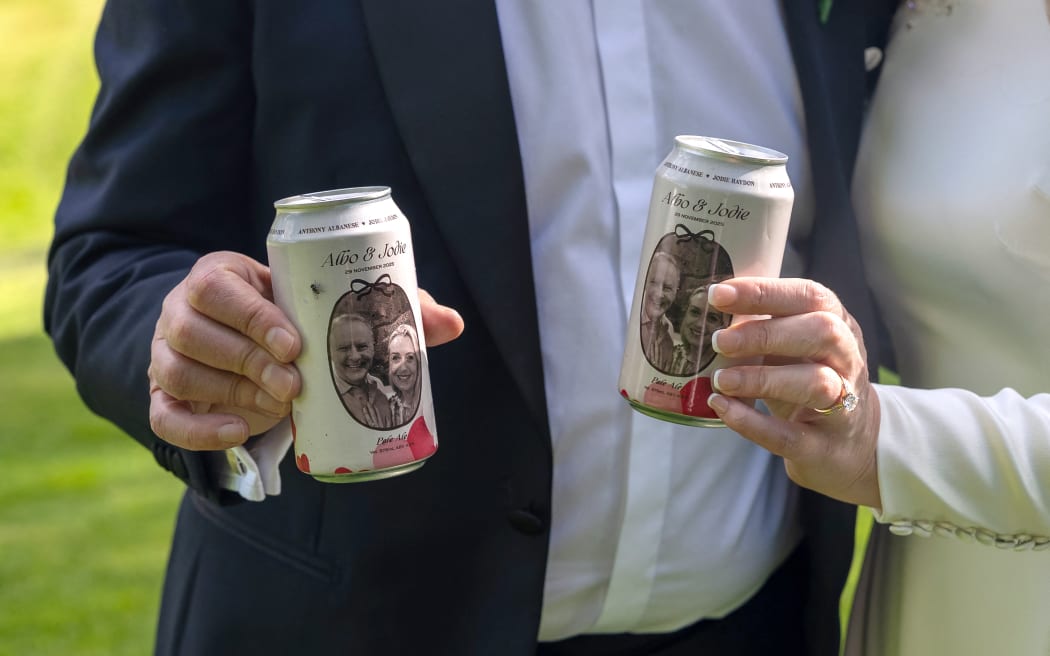Custom made beer cans are seen during the wedding ceremony for Australia's Prime Minister Anthony Albanese and his new wife Jodie Haydon in Canberra on November 29, 2025. (Photo by MIKE BOWERS / AFP) / -- IMAGE RESTRICTED TO EDITORIAL USE  - STRICTLY NO COMMERCIAL USE --