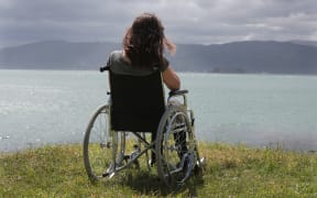 080114. Photo Diego Opatowski / RNZ. Model posing as a disabled on a wheelchair looking at the ocean.