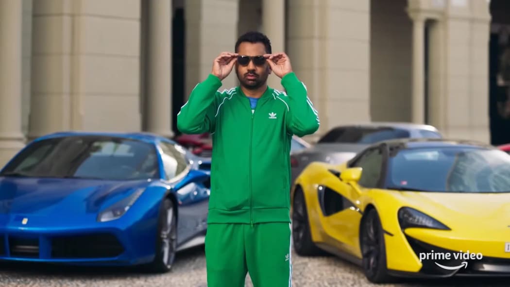 Kal Penn, in trademark primary tracksuit, presents This Giant Beast That is the Global Economy.