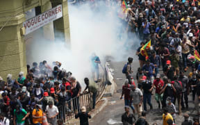 Security forces fire tear gas to disperse an anti government protest rally outside the  presidents official residence, on 9 July, 2022, in Colombo, Sri Lanka.