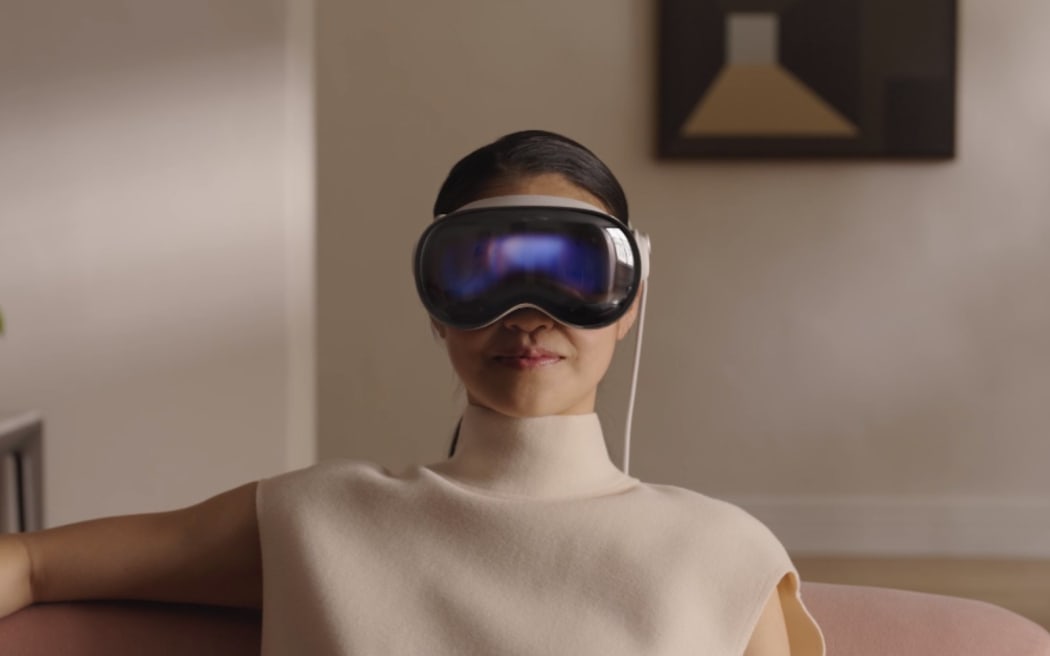 A woman wears Apple's Vision Pro headset.