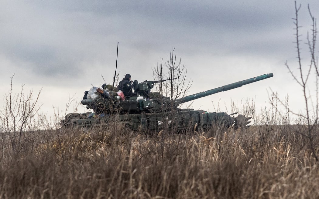 Ukrainian servicemen take position with a tank on the outskirts of Bakhmut, eastern Ukraine.
