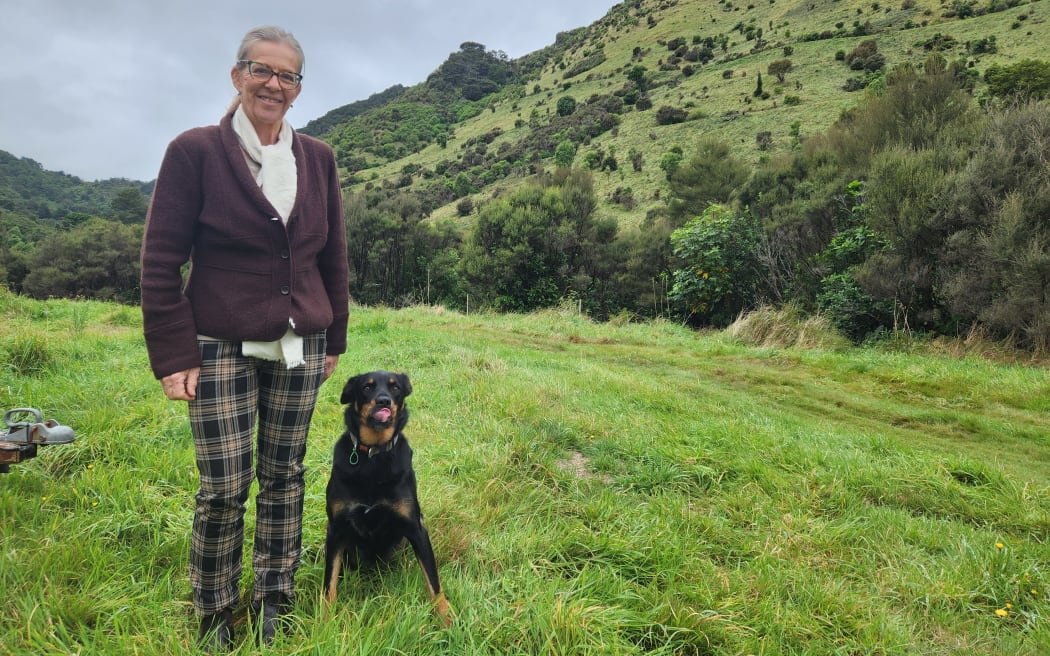 Celia Wade-Brown with Skye on her regenerating land in the Mangatarere Valley