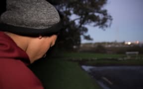 A teenage Māori boy looking unhappy