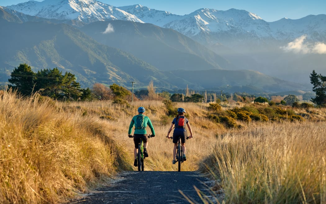 Why is "people power" being used to build the trail?