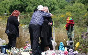 Sonya Rockhouse receives a hug from Bernie Monk at a memorial site for 29 men near the turnoff to the Pike River Mine. 
 


CONAN YOUNG / RNZ