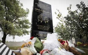 Outside the Masjid Annur, flowers surround the memorial to the 51 shuhada (martyrs) who were killed when a terrorist opened fire at two mosques  in Christchurch five years ago.