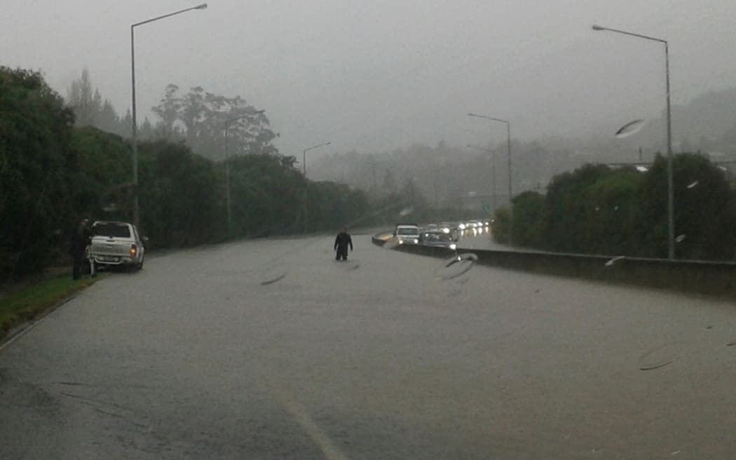 Flooded northbound lanes on the southern motorway at Green Island.