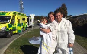 Alison, Mark and Barney Hossain after the decontamination shower.