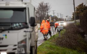Roading contractors clearing debris ahead of the incoming weather event