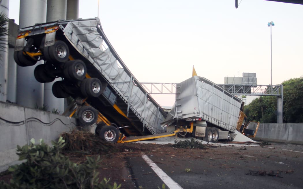 The truck and trailer unit plunged through a barrier at at Spagetti Junction on the Southern Motorway.
