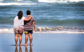 Family of the missing man looking at the sea