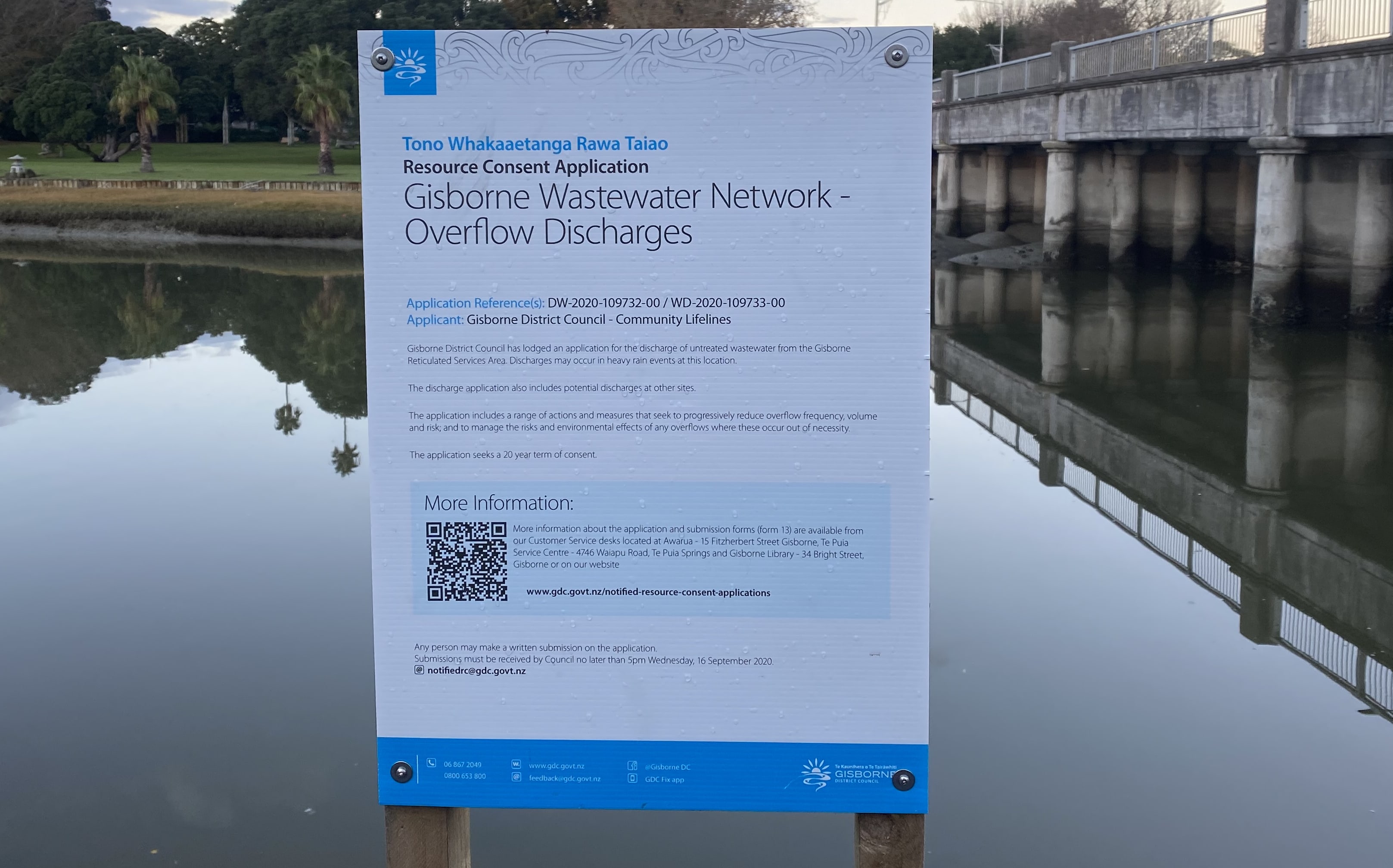 A sign erected on the banks of the Taruheru River, in the middle of the city, says untreated wastewater discharges might occur at this location in heavy rain events.