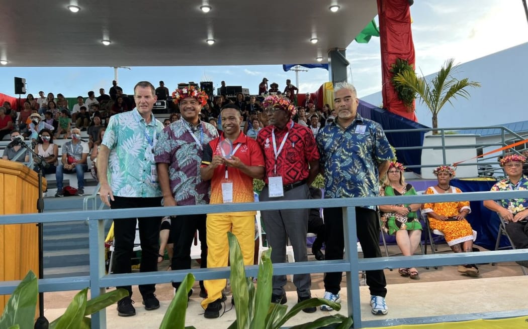Papua New Guinea’s Morea Baru, third from left, poses with, from left, Pacific Games Council CEO Andrew Minogue, CNMI acting governor Jude Hofschneider, Pacific Games Council president Vidya Lakhan, and Mini Games Organizing Committee chair Marco Peter.