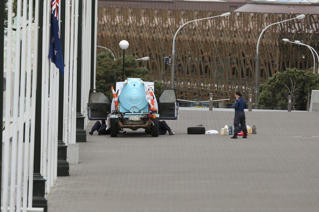 Police check the vehicle at Parliament.
