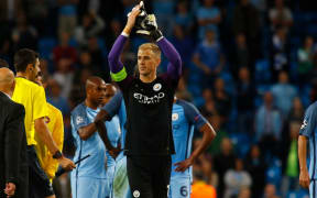 Manchester City goalkeeper Joe Hart applauds the crowd following his side's win in the Champions League.